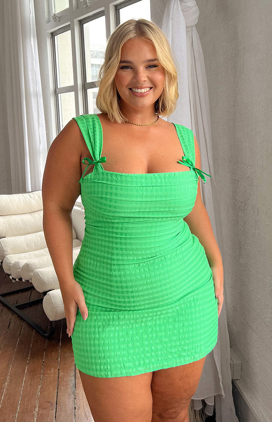 Green tie back mini dress with bow detailings.